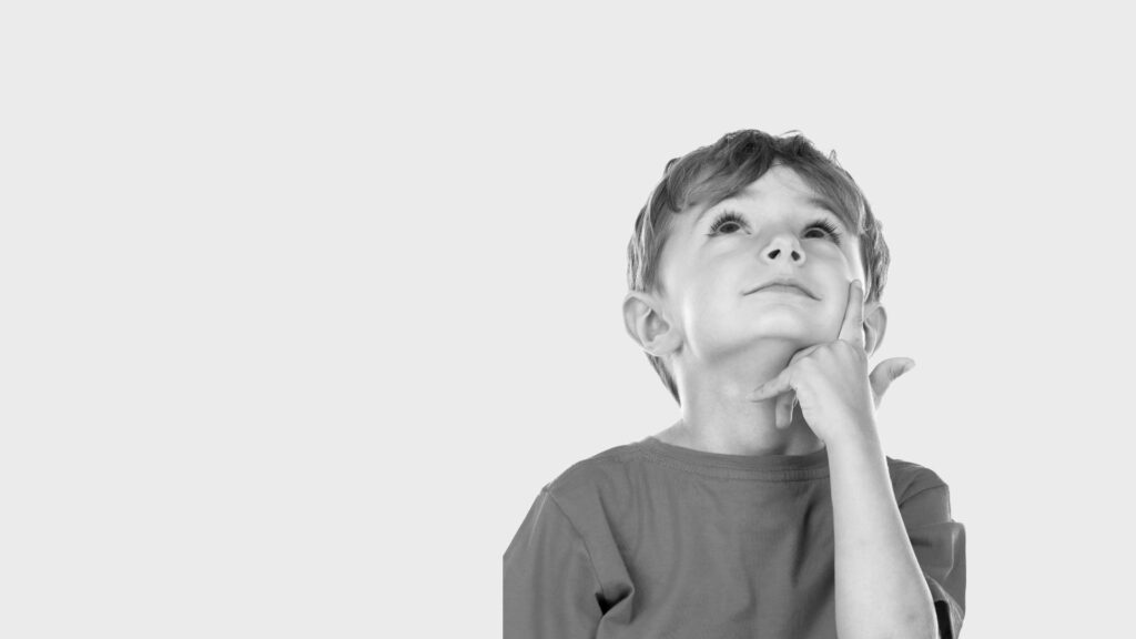 Child looking up thinking - Emotional Development Banner