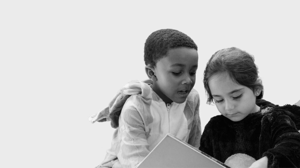 Two kids Reading - Social Development Banner